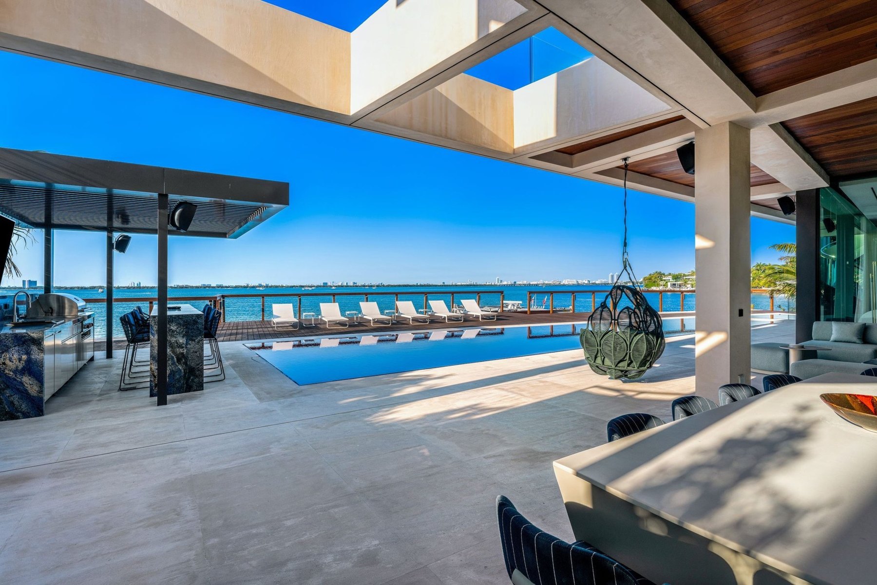 Contemporary Miami waterfront residence with a terrace overlooking the bay